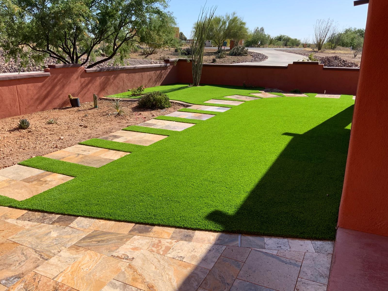 Artificial grass lawn with flagstone stepping stone path in Phoenix Arizona