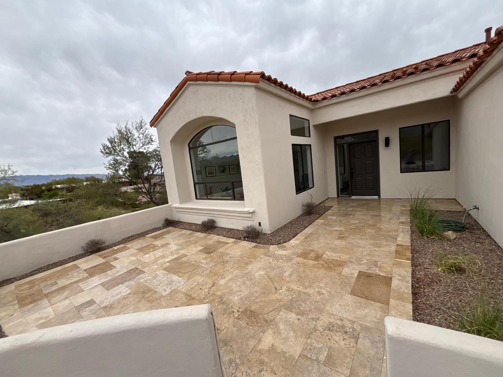 Sealed travertine courtyard entry at a Spanish-style Arizona home