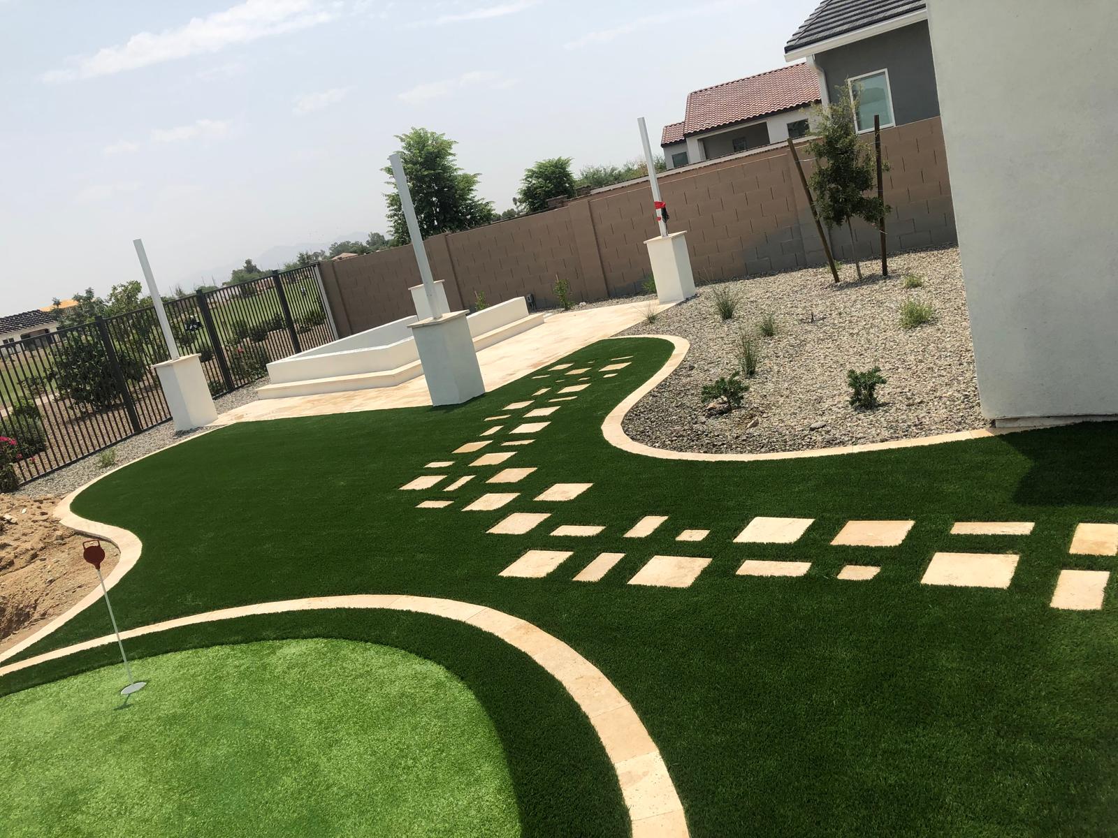 Backyard putting green with artificial grass and paver walkway in Phoenix Arizona