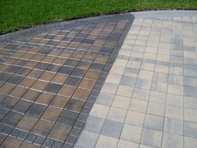 Gray and brown paver sections with contrasting borders beside grass in Phoenix Arizona