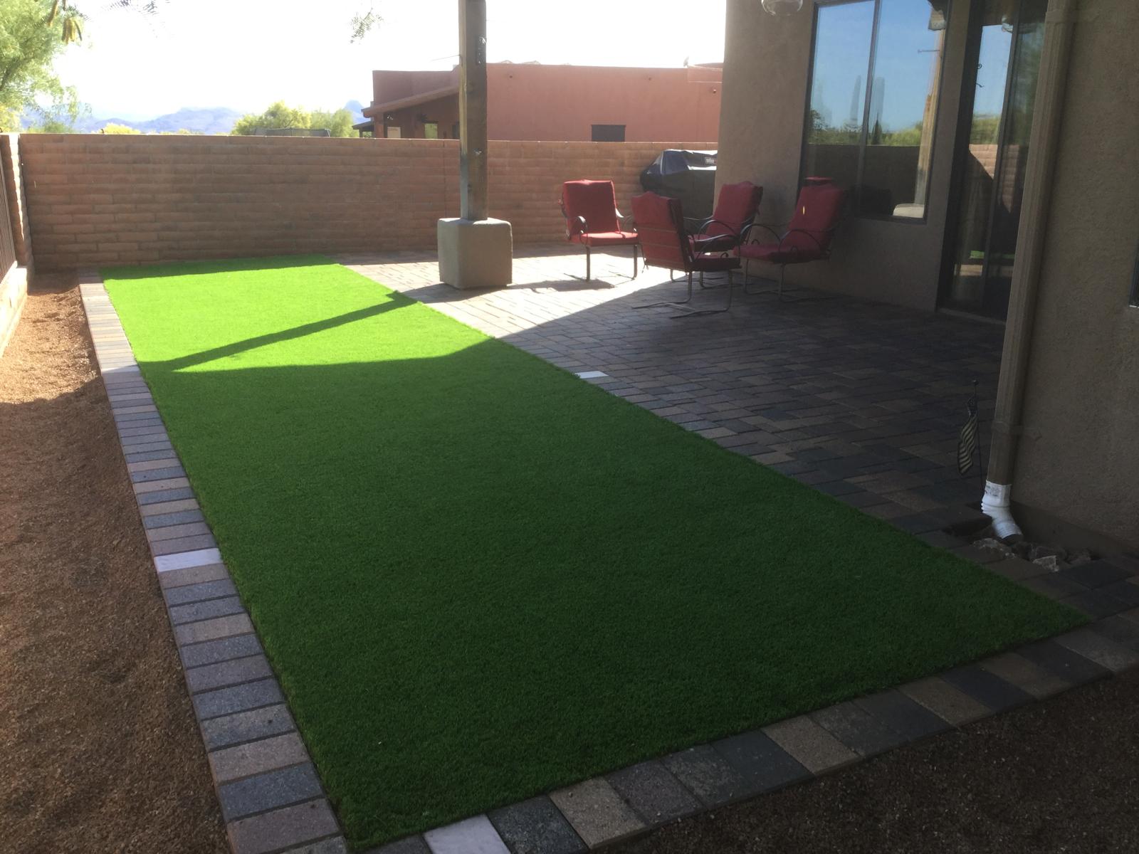 Artificial grass with paver border edging at a Phoenix Arizona home