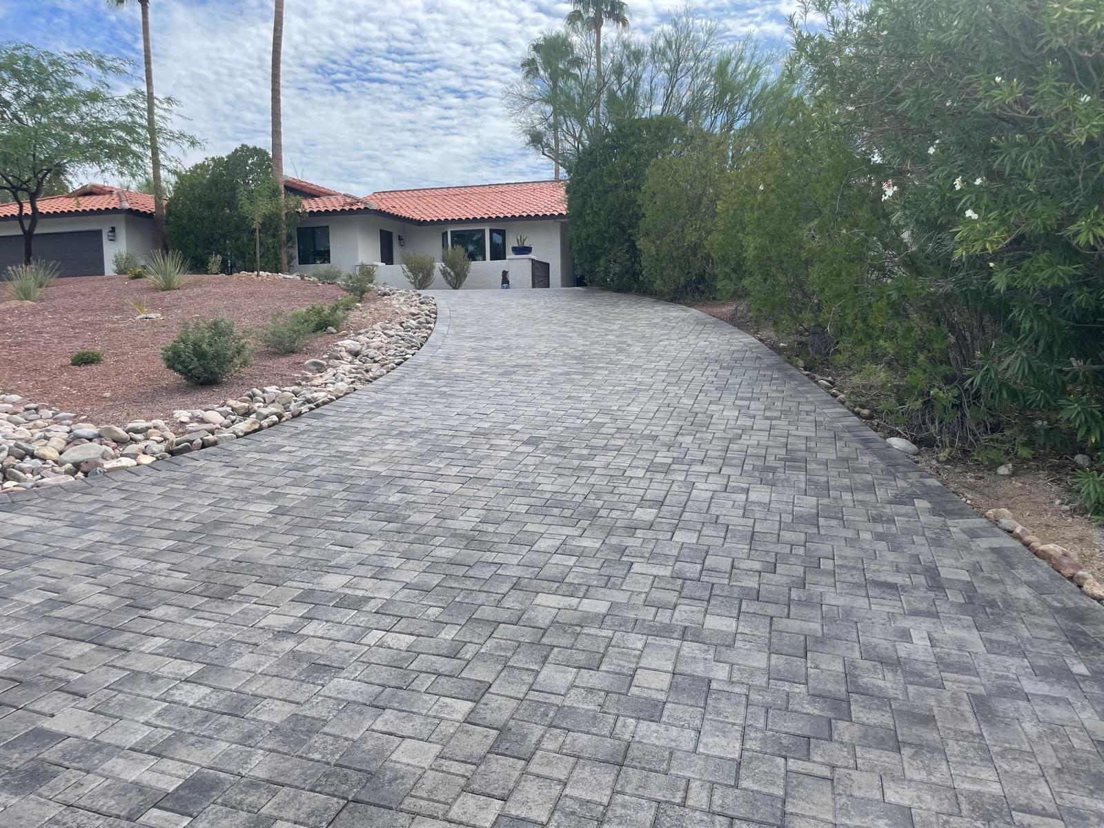 Gray cobble paver driveway with desert landscaping at a Phoenix Arizona home