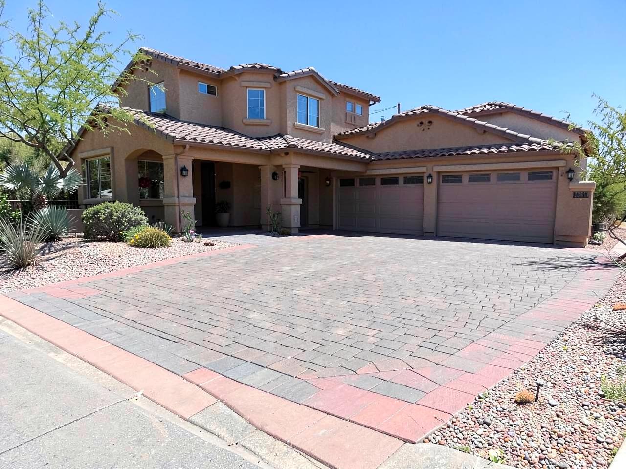 Brick paver driveway installation with contrasting border in Phoenix Arizona